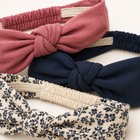 Close-up of the headband fabric, centre knots and gathered elastic backs