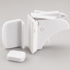 Close-up of the white curved cabinet latch, catch, adhesive surfaces and magnetic keys