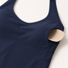Close-up of the navy sports tank top fabric, stitching and removable cup pad
