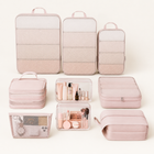 Blush pink 10-piece packing cube travel organiser set arranged in a studio