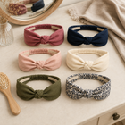 Six-piece boho knotted headband set arranged on a dressing table